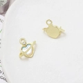 Detailed macro view showing the heart-shaped Saturn charm with iridescent center in gold - Iridescent Heart Planet (13# Gold Tone)