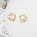 Macro detail of heart-shaped alloy pendant with pink crystal and golden filigree frame - Pink Iridescent Heart (18# Gold Tone)