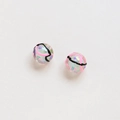 Macro shot of two translucent tulip glass beads with hand-painted patterns and iridescent foil - Polka Dot Spiral Pattern Style (3#)