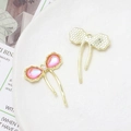Detailed close-up of pink bow charms with pearl accents for DIY jewelry making - Pink-Orange Pearl Bow (21# Gold Tone)