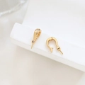 Macro shot of gold plated pearl bail with zircon stone and peg for DIY jewelry - Style 3