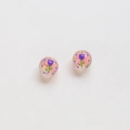 Macro detail of handmade round beads with hand-painted purple tulips and floral patterns - Purple Tulip Polka Dot Style (17#)