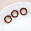 Three brown metal spring ring buckles on a white decorative plate for DIY crafts - 2# Small Round Ring (Single)