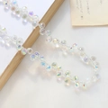 Detailansicht von facettierten Glastropfenperlen mit schillerndem Aurora-Effekt für DIY-Schmuck - 1 Strang (ca. 100 Perlen) / Klar Aurora (2#)