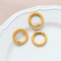 Three bright yellow spring O-rings for DIY crafts placed on a textured white ceramic plate - 9# Small Round Ring (Single)