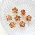 Detailed macro view of amber glass flower beads with pink rose accent for DIY jewelry - Amber Style (3#)
