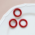 Three red metal O-rings with smooth coating on white ceramic plate for DIY projects - 14# Small Round Ring (Single)