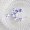 Detail of oval ceramic beads with blue polka dots on white background for DIY jewelry crafts - White with Blue Polka Dots (7#)