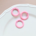 Three pink matte round spring o-rings on a white ceramic plate for DIY jewelry making - 18# Small Round Ring (Single)