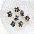 Macro detail of hand-painted floral glass beads with gold glitter and rose patterns - Black With Glitter (9#)