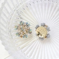 Macro detail of iridescent flower charm with pearls, rhinestones and gold metal base - Style 6 (6#)