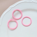 Close-up of three matte pink circular metal key rings for DIY jewelry on a white tray - 36# Large Round Ring (Single)