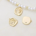 Detail of vintage gold-plated coin pendant with portrait relief and zircon on pearl necklace - Shield Goddess Relief Style (2#)