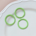 Close-up of three mint green macaron color metal key rings for DIY jewelry crafting - 40# Large Round Ring (Single)