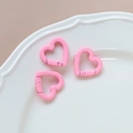 Close-up of three pink macaron heart-shaped metal spring rings on a white plate - 44# Small Heart (Single)