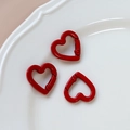 Close-up of three red heart-shaped metal spring clasps on a white ceramic tray - 45# Small Heart (Single)