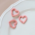 Three pink heart-shaped metal spring buckles on a white textured plate for DIY crafts - 46# Small Heart (Single)