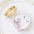 Close-up of 0.5mm 18k gold plated copper wire for DIY jewelry making in hexagon box - 3#0.5mm One Roll (About 10m)