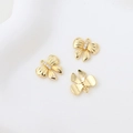 Detailed view of three gold-plated bow cat pendants with inlaid white zircon stones - 18k Gold Bowknot Pendant
