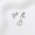 Macro detail of cat pendant charms with silver plating and cubic zirconia accents - White Gold Cat Pendant