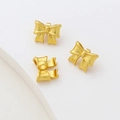 Detailed view of three 3D matte gold bow charms for DIY jewelry making and crafting - Bowknot (1#) / Gold