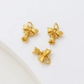 Three gold bowknot bell pendants with tulip buds and matte brushed texture details - Bowknot with Flower Dangle (2#) / Gold