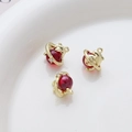 Macro view of gold dolphin charms with red beads for DIY jewelry making accessories - Gold Dolphin With Red Sphere