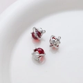 Macro shot of silver dolphin charms with red translucent beads for DIY jewelry making - Silver Dolphin With Red Sphere