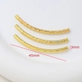 Close-up of 18K gold plated faceted spiral curved tube beads for DIY jewelry making - 18K Gold
