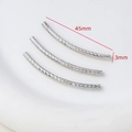 Detailed view of silver 45mm threaded curved tube spacers for DIY jewelry making - White Gold