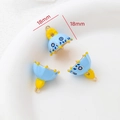 Macro view of blue and yellow enameled bell-shaped charms with 18mm size scale - Ghost Hat (Style 1)