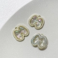 Détail macro de breloques nœuds en alliage avec résine irisée et perles pour bijoux DIY - Style Nœud Or Aurora Perle Artificielle (2# Prix Unitaire)
