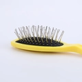 Spazzola ovale gialla con setole in metallo e cuscinetto d'aria nero per capelli - Giallo