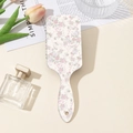 Detailansicht der Massagebürste mit floralem Muster, rosa Schleifen und Tulpen - Rosa Rosen Stil (A)
