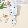 Detail of dachshund print hairbrush with air cushion on a checkered blue background - Blue Puppy Gingham Style