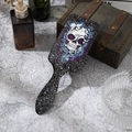 Detailed view of Gothic rose and skull pattern on hairbrush in lifestyle setting - Blue Rose Butterfly Skull (B)