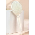Pearlescent white air cushion massage hairbrush with ergonomic handle and silver ring detail - White