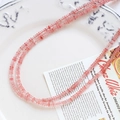 Detailed shot of pink translucent flat round natural stone beads for DIY jewelry making - Pink Flat Round (4# Single Strand)