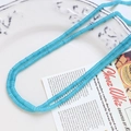 Detailed view of turquoise-colored agate beads on a white ceramic plate for DIY jewelry - Teal (5# Single Strand)