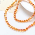 Close-up of translucent orange heart glass beads for DIY jewelry making and necklaces - 1 Strand (Approx. 86 Beads) / 6# Orange