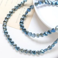 Macro shot of blue transparent heart-shaped beads for DIY jewelry and necklace crafting - 1 Strand (Approx. 86 Beads) / 10# Greenish Brown