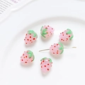 Detail view of pink strawberry glass beads for DIY jewelry making displayed on a white plate - 2# Pink Strawberry