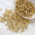 Detailed view of gold plated plum flower spacer beads for DIY jewelry making and crafts - Five-petal Flower Style / 10 Pieces/Pack (4mm) / 14K Gold