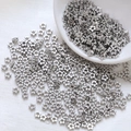 Close-up of silver five-petal flower metal spacer beads for DIY jewelry making - Five-petal Flower Style / 10 Pieces/Pack (4mm) / Silver