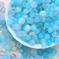 Macro detail of mixed blue DIY beads with ice crackle and aurora luster in a ceramic bowl - 75g / Blue Series