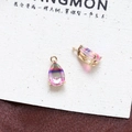 Macro shot of two pear-shaped rainbow zircon pendants with gold plated four-claw settings - Style 7 (7#)