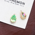 Macro view of pear-shaped aurora crystal pendants with gold multi-prong settings - Style 22 (22#)