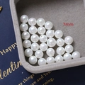 Macro shot of 7mm white high-luster pearl beads for DIY jewelry making on grey velvet - Style 2 / 1 Piece (7mm) / White