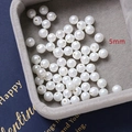 Detailed macro view of 5mm high-gloss white DIY jewelry pearls on velvet tray - Style 4 / 1 Piece (5mm) / White