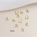 Macro detail of 6mm gold plated flower bead caps for DIY jewelry making accessories - Gold 3-Petal Flower (4#6mm)